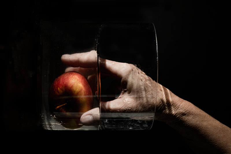 <img src="hand.jpg" alt="a hand reaches for an apple in water">  height="300" width="300"