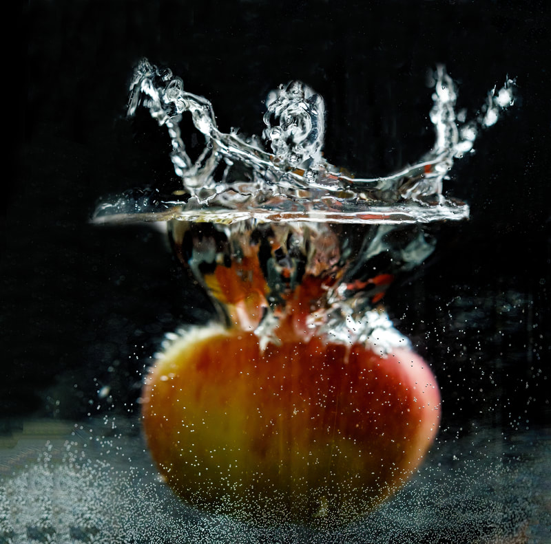 <img src="apple.jpg" alt="an apple plunges into water">  height="300" width="300"