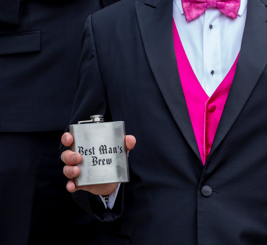 the best man hold his flask that read 